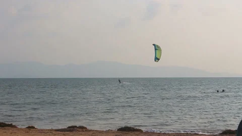 A man practicing kite surfing in the sea Stock Footage 102888708