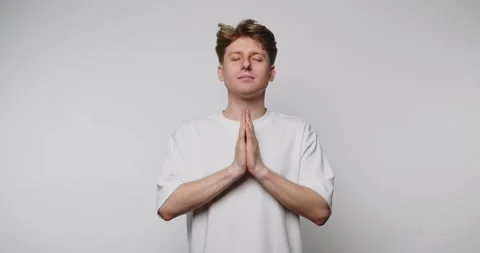Man practicing meditation in a calm environment with hands together in a pr.. Stock Footage 316180834