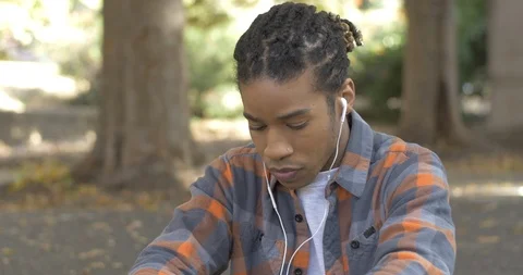 Man Practicing Mindfulness in Park and Reflecting Stock Footage 121410509