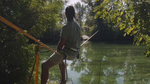 Man practicing slackline over the surface of the river 스톡 동영상 140338871