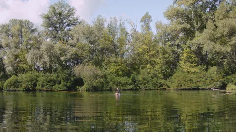 Man practicing slackline over the surface of the river 스톡 동영상 140690079