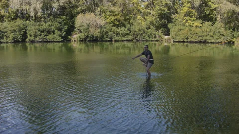Man practicing slackline over the surface of the river 스톡 동영상 140693952