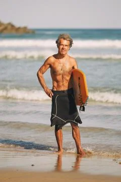 Man practicing surfing on the basque coast, donostia Stock Photos
