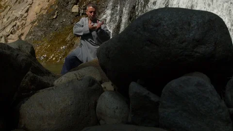 Man Practicing Tai-Chi In Nature Stock Footage 129903391