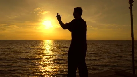 Man practicing Tai Chi at the sea Stock Footage 81222372
