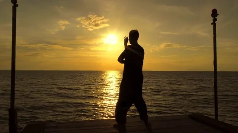 Man practicing Tai Chi at the sea Stock Footage 81225317