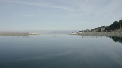 Man Practicing Yoga On A Beautiful Blue Lake Stock Footage 201404290