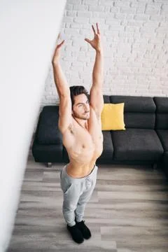 Man Practicing Yoga At Home Doing Sun Salutation Routine Stock Photos
