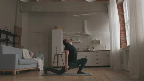 Man Practicing Yoga at home Stock Footage 151440028