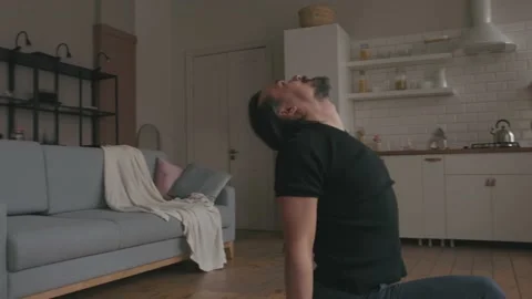 Man Practicing Yoga at home Stock Footage 153124398