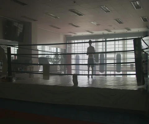 Man practising hitting and punching with red gloves in boxing ring, Japan Video stock 147057179