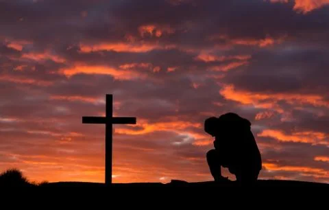 Man in pray cross Foto stock