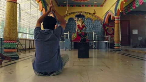 Man in prayer, hands joined together, expressing devotion and reverence Video stock 244388024