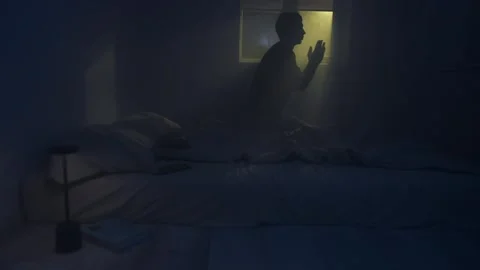 Man praying and asking God for help at night Video stock 320179969