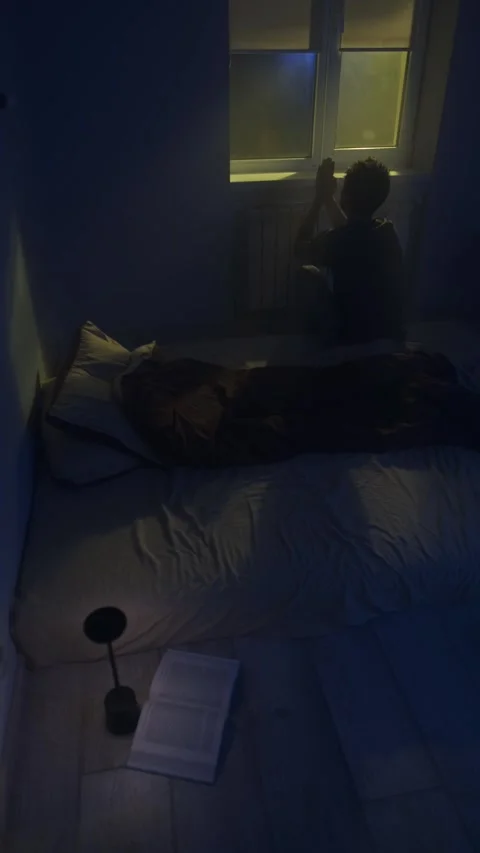 Man praying and asking God for help at night vertical video Stock Footage 321002413