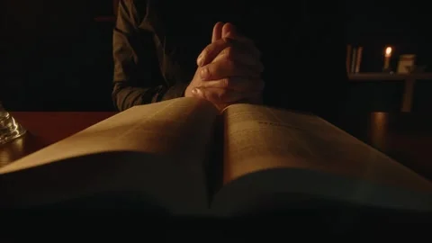 Man Is Praying and Reading Bible Stock Footage 279560153