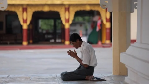 Man praying in Buddhist temple, Myanmar Stock Footage 102634619