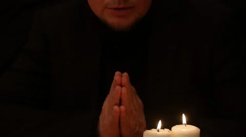 Man praying with folded isolated palms and part of face 4k Stock Footage 45818890