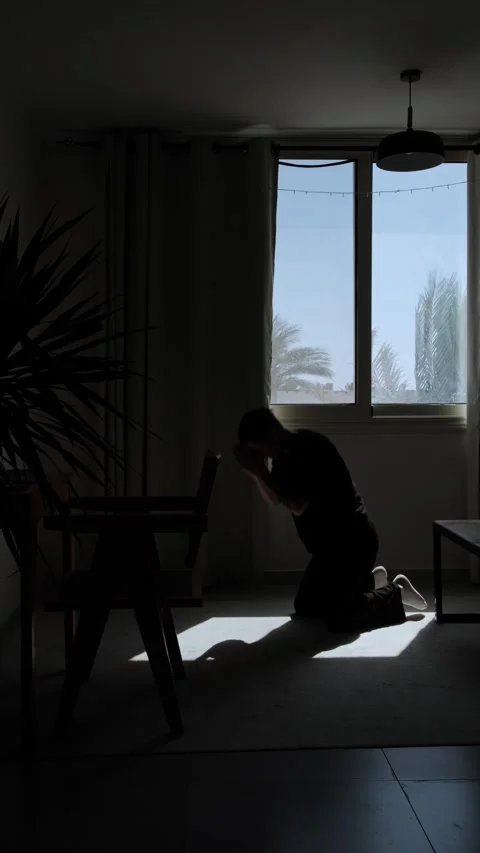 Man praying on his knees and bowing down in desperate prayer, seeking hope and Stock Footage 346244448