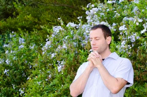 Man praying outside. Stock Photos