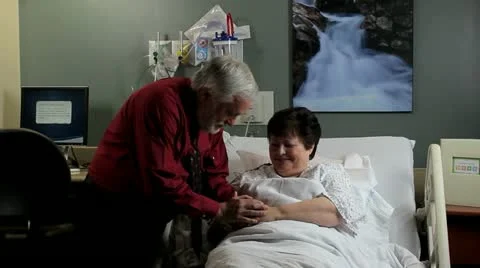 Man praying with patient Stock Footage 12508241
