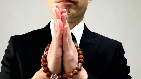 A man praying with prayer beads. Stock Footage 336047715