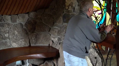 Man praying in small chapel Stock Footage 67876993