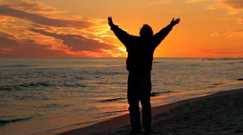 Man Praying At Sunset Stock Footage 10724202