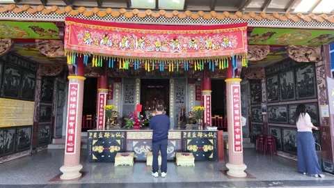 Man praying at traditional temple altar in Taipei Stock Footage 345998650