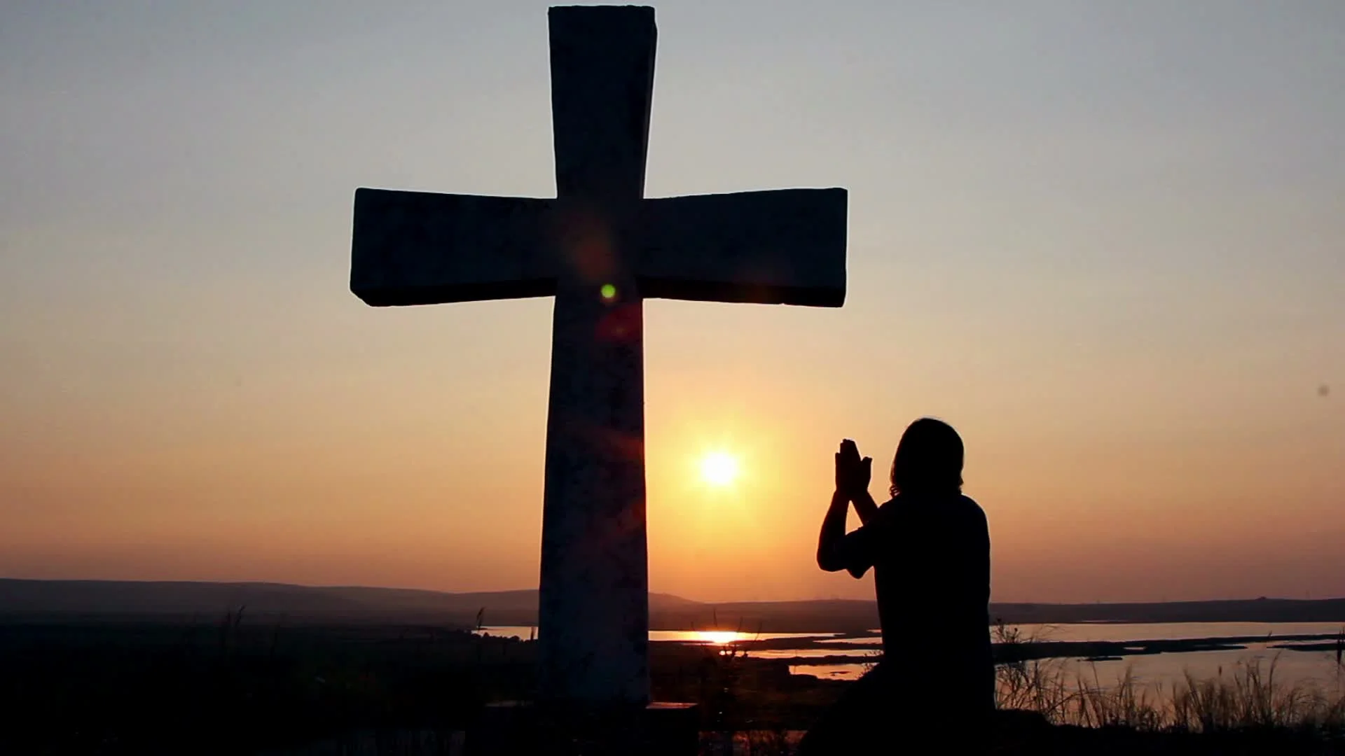 praying at the cross