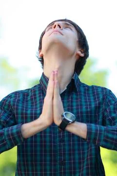 Man prays Stock Photos
