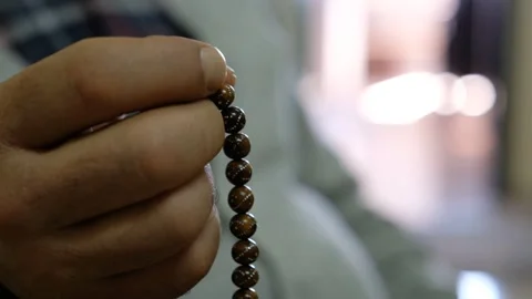 A Man Prays with the Rosary Stock Footage 241702874