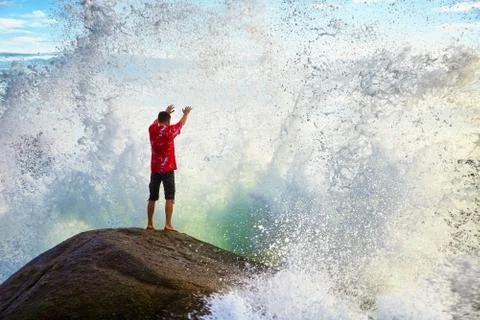 Man prays sea elements Stock Photos
