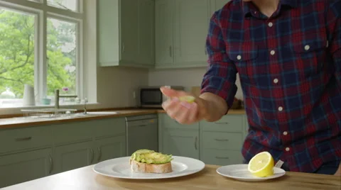 Man prepairing a healthy lunch while at home. Stock Footage 63010704