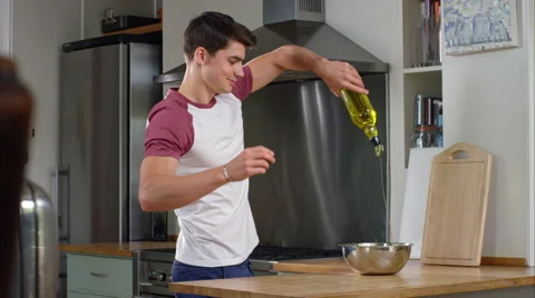 Man prepairing a healthy lunch while at home. Stock Footage 63030558