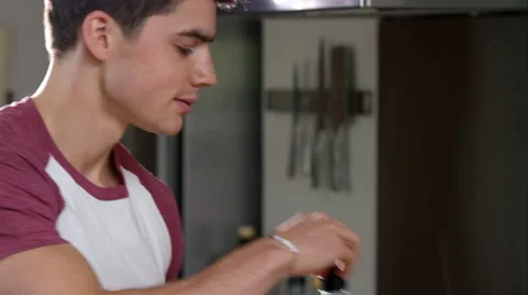 Man prepairing a healthy lunch while at home. Stock Footage 63032338