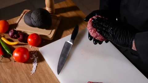 Man prepare and form meat cutlet for a hamburger 4k Stock Footage 94034737