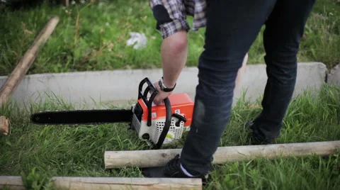 Man prepared a chainsaw to work Video stock 59366449