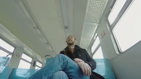 Man prepares and gets off the train 動画素材 153616668