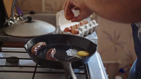 Man prepares breakfast in the kitchen Stock-Footage 63205489