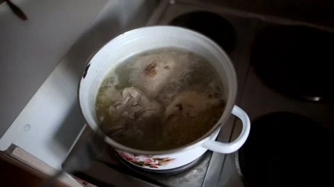 Man prepares chicken soup Video stock 137295845