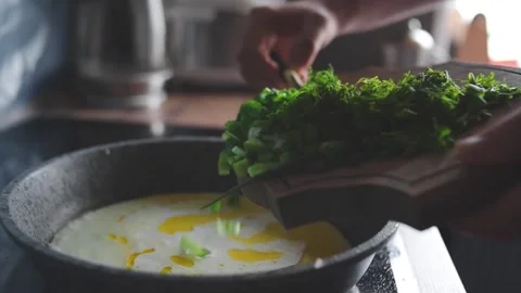 A man prepares a cream sauce Stock Footage 131495710