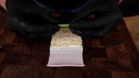 A man prepares delicious snacks Stock-Footage 128636814