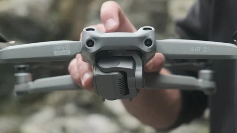 Man prepares a drone for a flight. DJI Air 2s. Camera Calibration Stock Footage 243419638