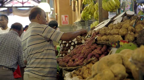 Man prepares exotic market stall Stock Footage 32195909