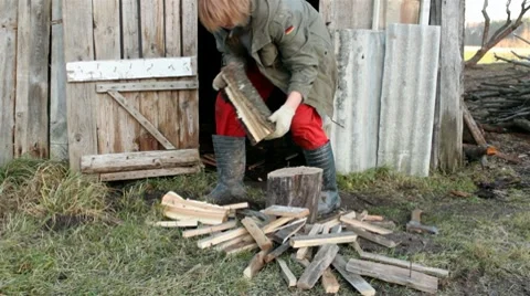 Man prepares firewood Stock Footage 10580352