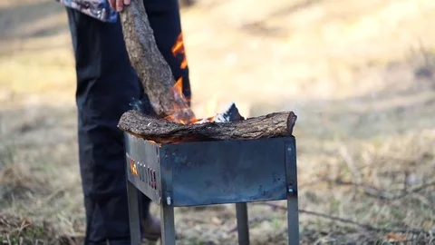 Man prepares grill for the barbecue Stock Footage 73477963