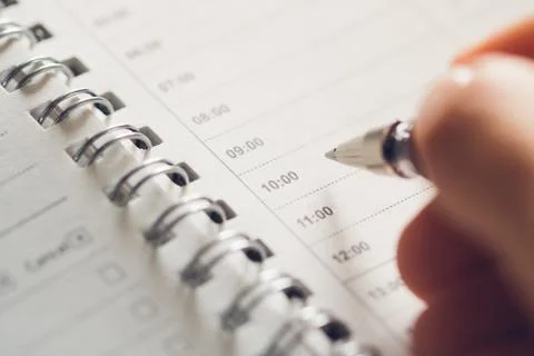 Man prepares to make a schedule for the day. Empty schedule sheet for time ma Stock Photos
