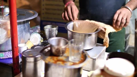 A man prepares masala tea in in Mumbay Stock Footage 264085239
