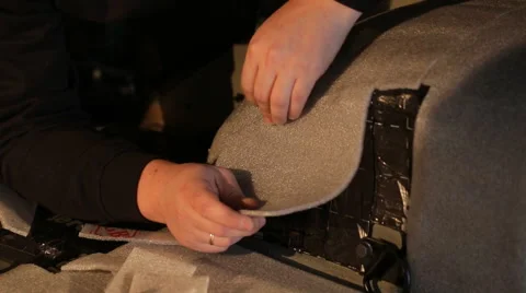 Man prepares material for soundproofing Stock Footage 56024611